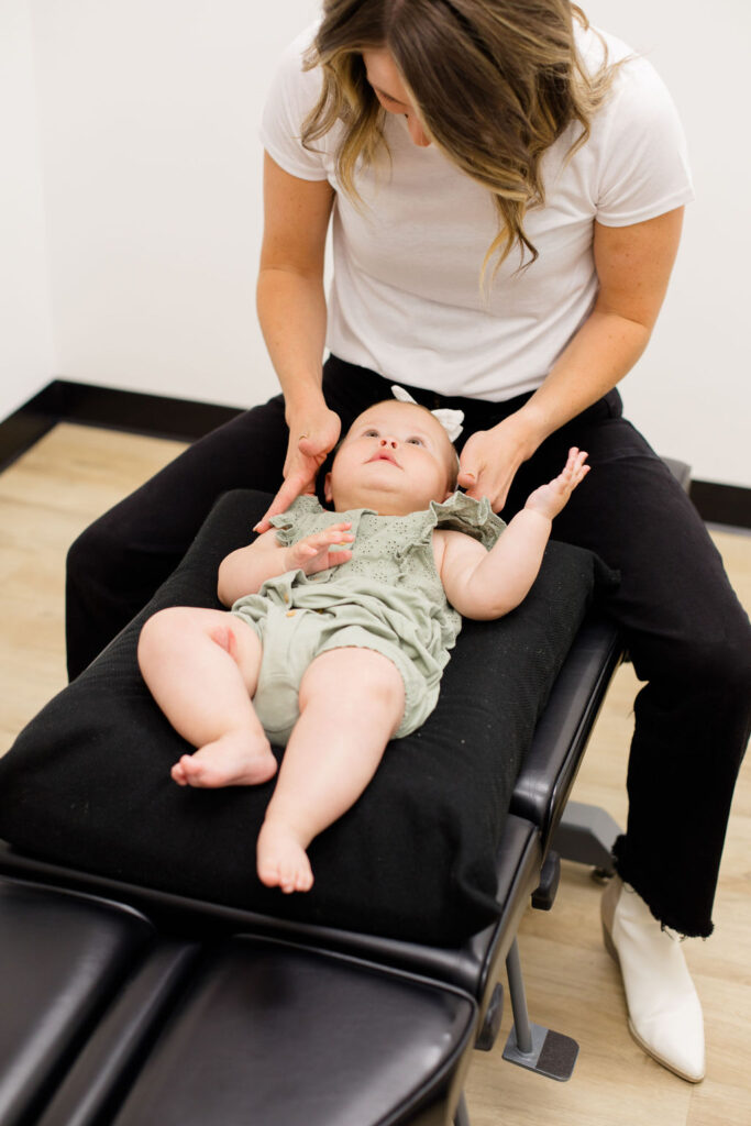 pediatric chiropractor with patient 