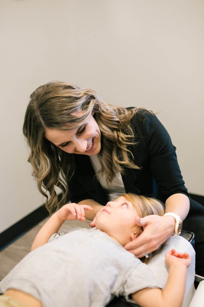 kid getting chiropractic treatment