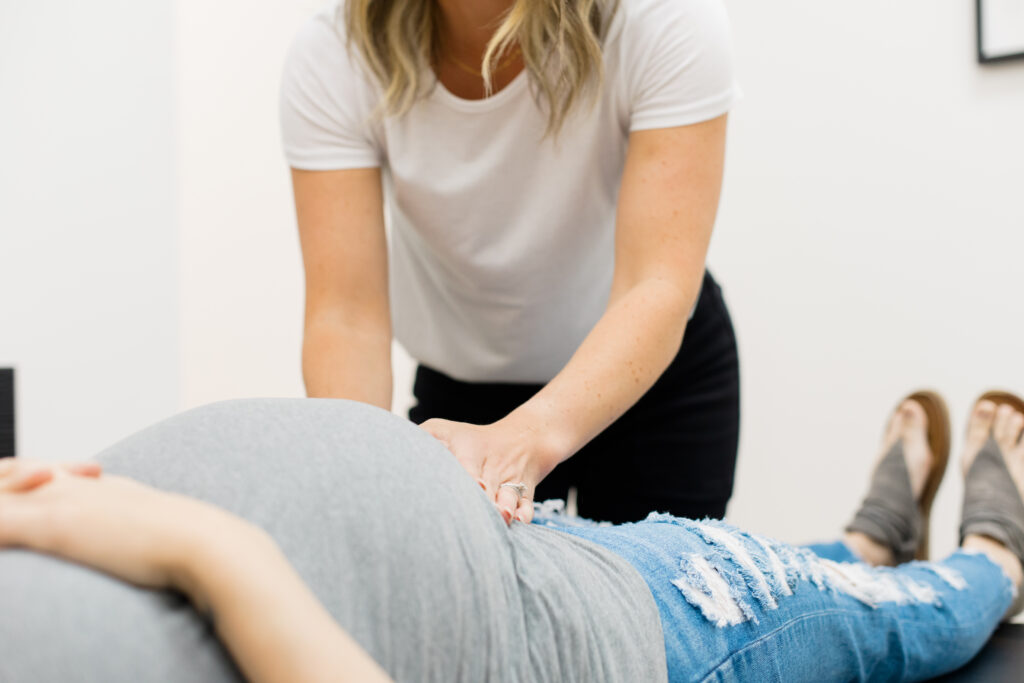 Chiropractic adjustment on prenatal patient using the webster technique for optimal baby positioning. 
